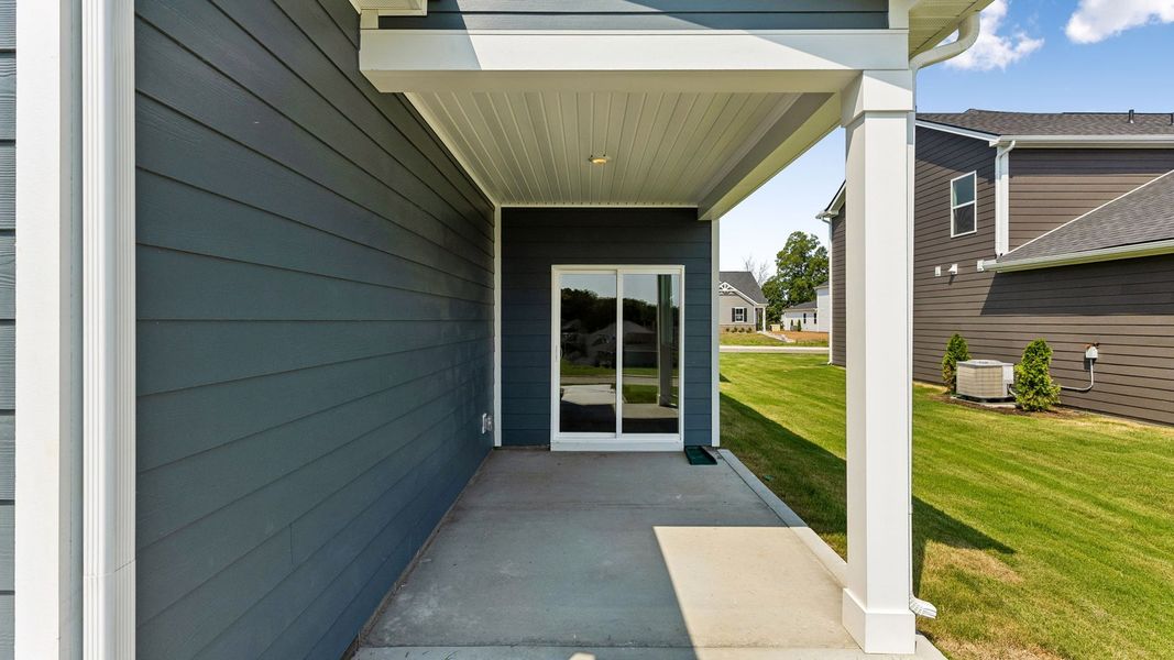 Exterior details and patio area of a home in Reserve at Hickory Ridge, Columbia (Image 30).