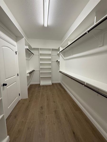 Huge walk in closet with 2 shoe box shelves