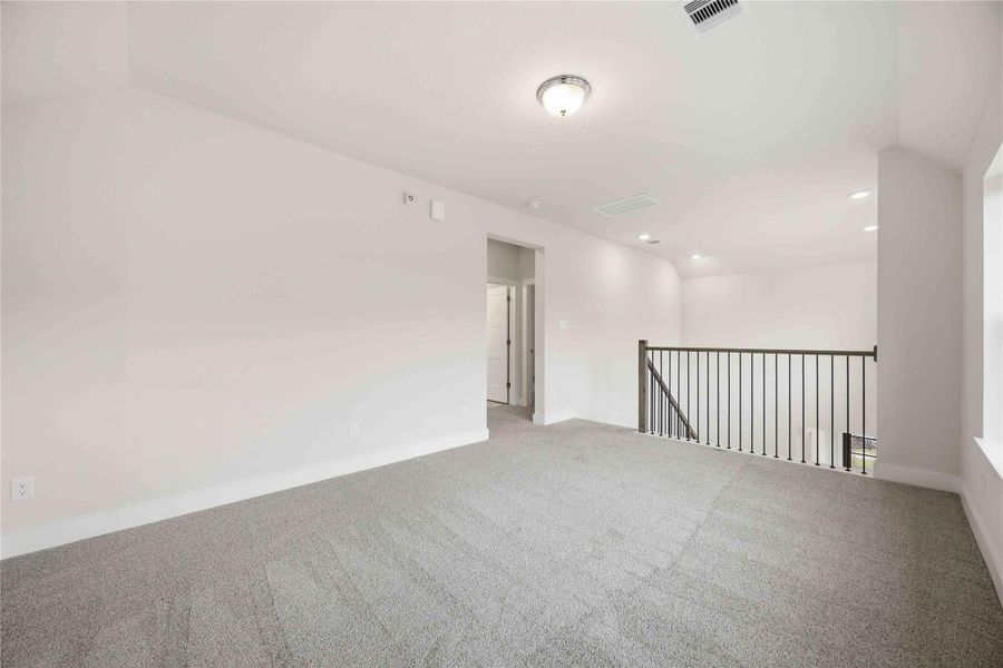 Spacious, unfurnished interior of a new home in Ellwood, Iowa Colony (Image 23).