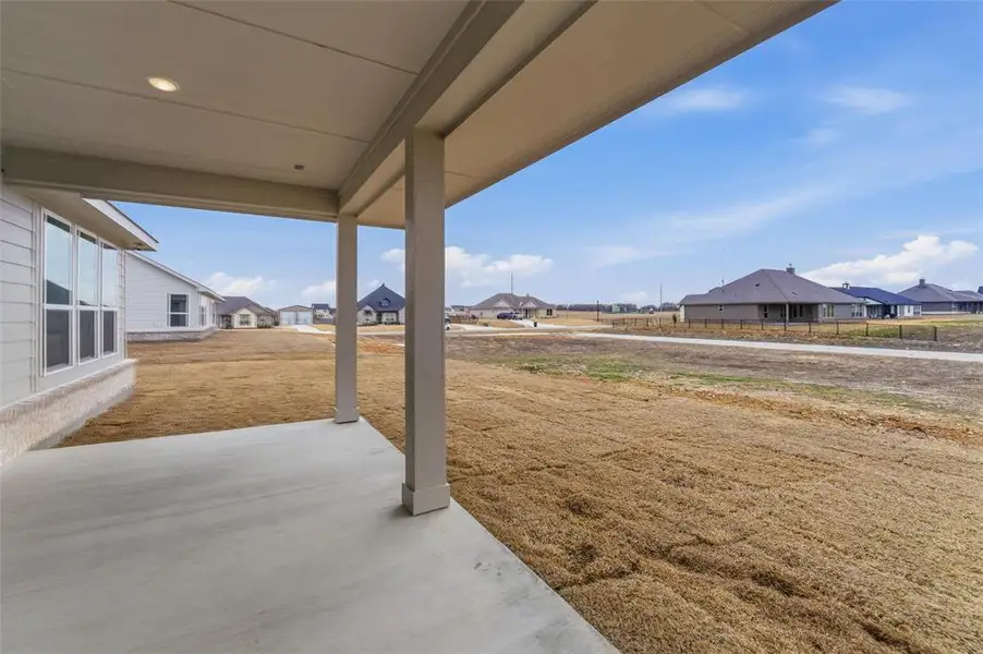 View of yard featuring a residential view and a patio