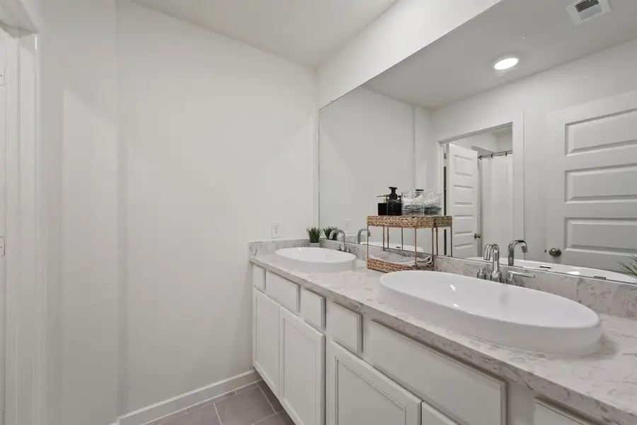 Upstairs full bath with a double vanity. Upstairs full bath with a double vanity.