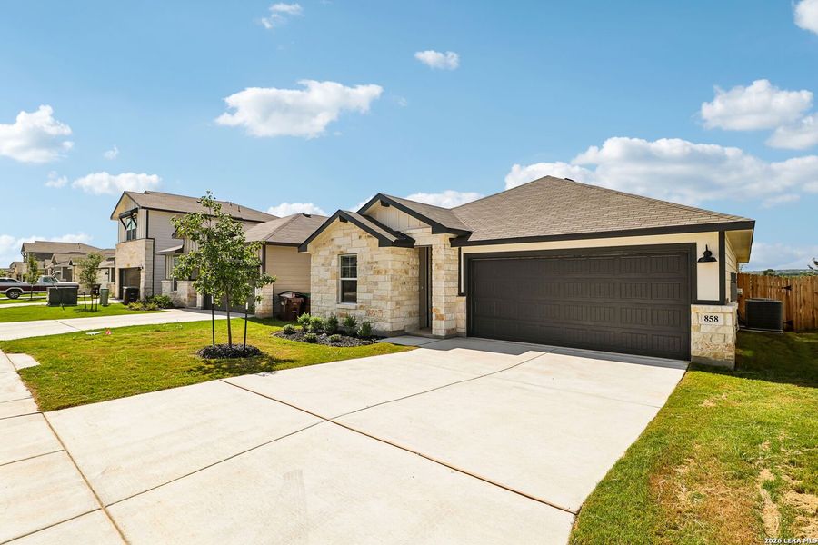 Front exterior of a new home in Estancia Ranch - Premier Series, San Antonio, TX, highlighting curb appeal (Image 22). Front exterior of a new home in Estancia Ranch - Premier Series, San Antonio, TX, highlighting curb appeal (Image 22).
