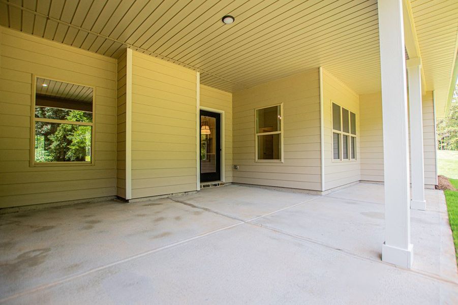 Exterior details and patio area of a home in WOODMONT RESERVE, Roopville (Image 35).
