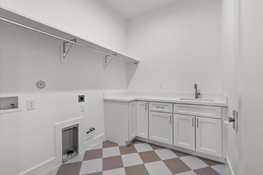 Spacious utility room with built-in storage. Spacious utility room with built-in storage.