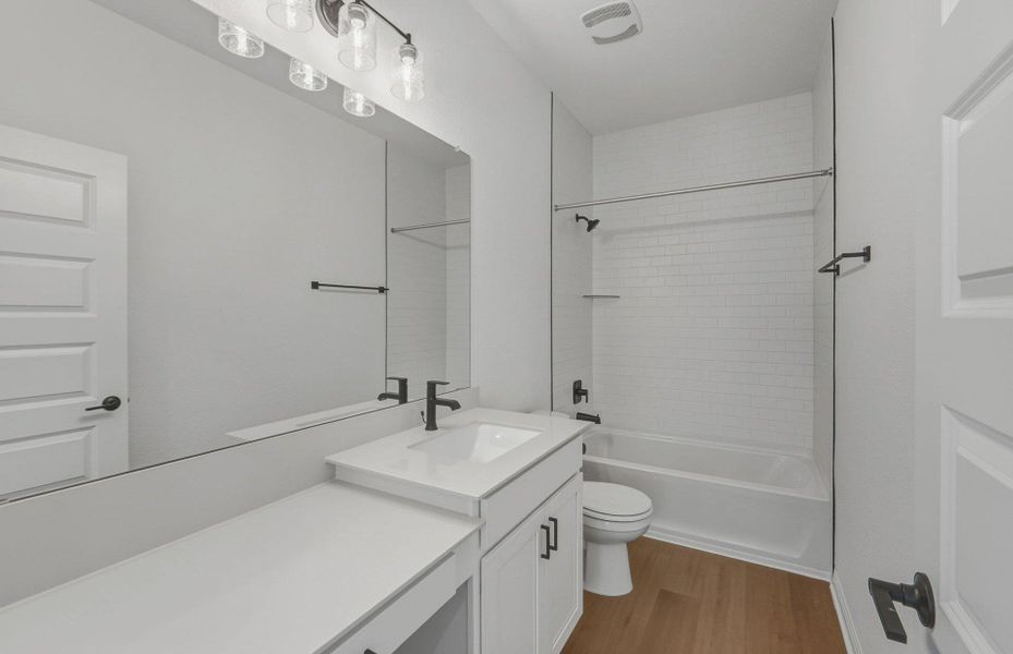 Furnished interior view inside a new home in Bluffview Reserve, Leander (Image 6).