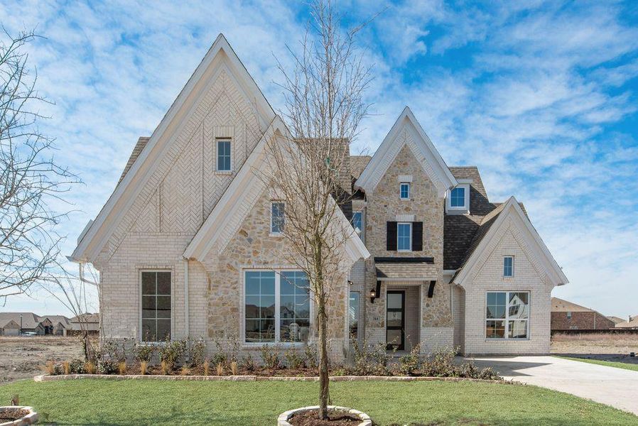 Front exterior of a new home in Park Trails, Forney, TX, highlighting curb appeal (Image 1).