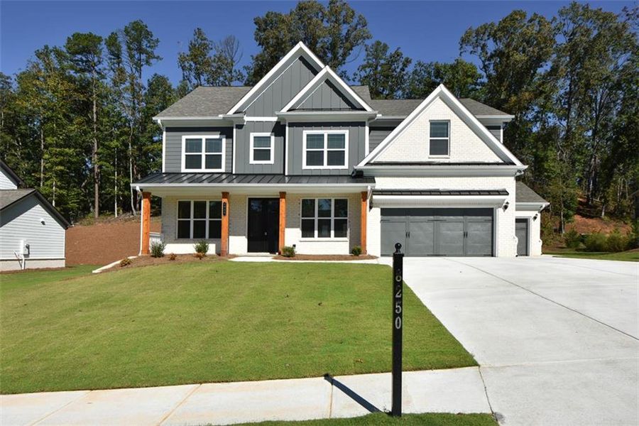 Front exterior of a new home in , Cumming, GA, highlighting curb appeal (Image 26). Front exterior of a new home in , Cumming, GA, highlighting curb appeal (Image 26).