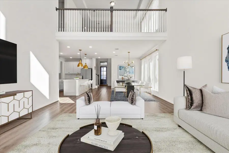 Living room with a high ceiling, dark wood-style flooring, a chandelier, and recessed lighting. Virtual Staging Added. Living room with a high ceiling, dark wood-style flooring, a chandelier, and recessed lighting. Virtual Staging Added.