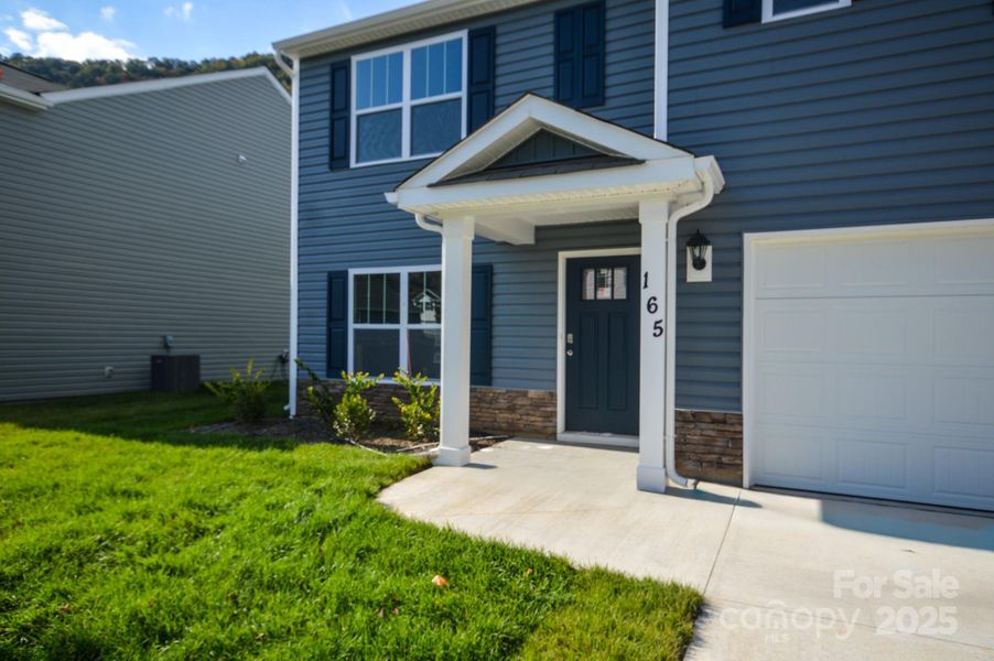 Exterior details and patio area of a home in Wildbrook Village, Waynesville (Image 2).