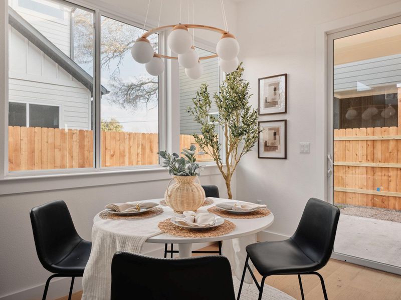 Dining room featuring wood finished floors and baseboards