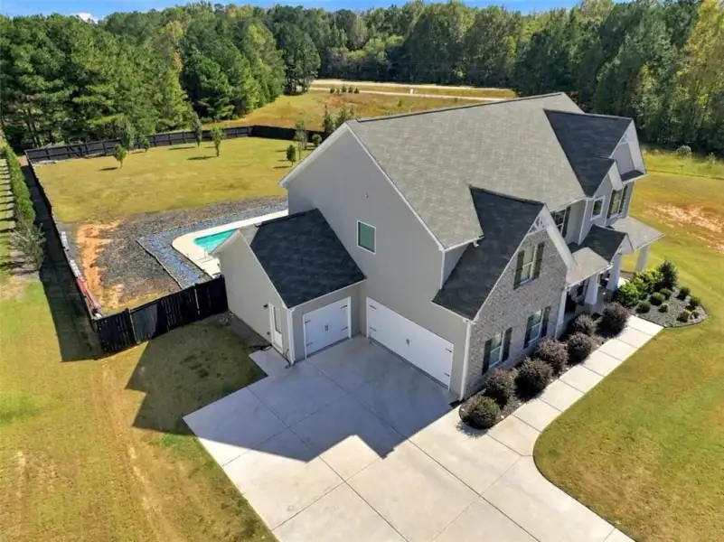 Front exterior of a new home in Joel's Landing, Monroe, GA, highlighting curb appeal (Image 24).
