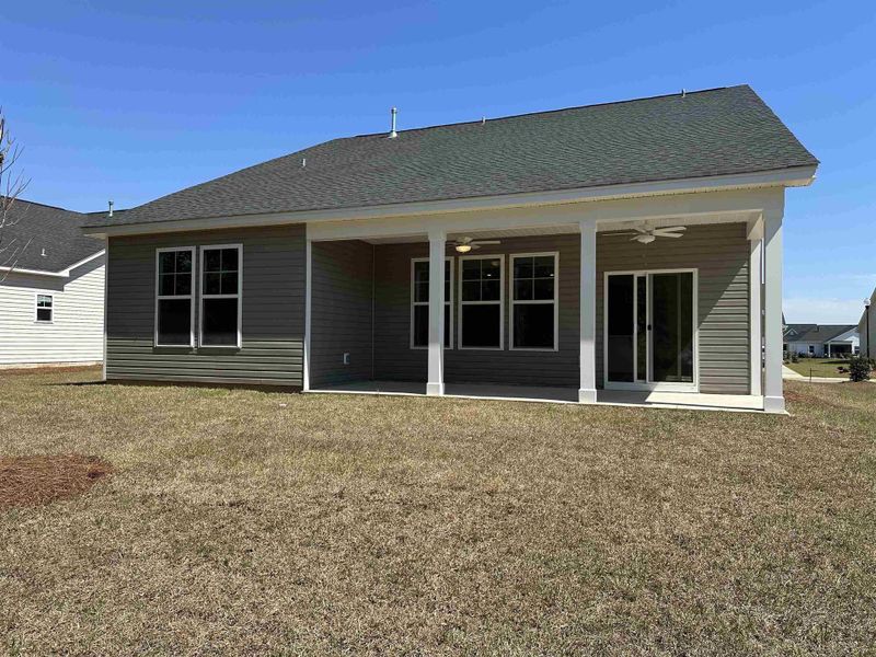 Exterior details and patio area of a home in Oak Hollow, Longs (Image 3).