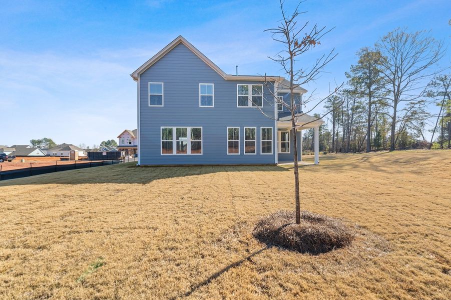 Exterior details and patio area of a home in Cottages at Lake Emory, Inman (Image 4).