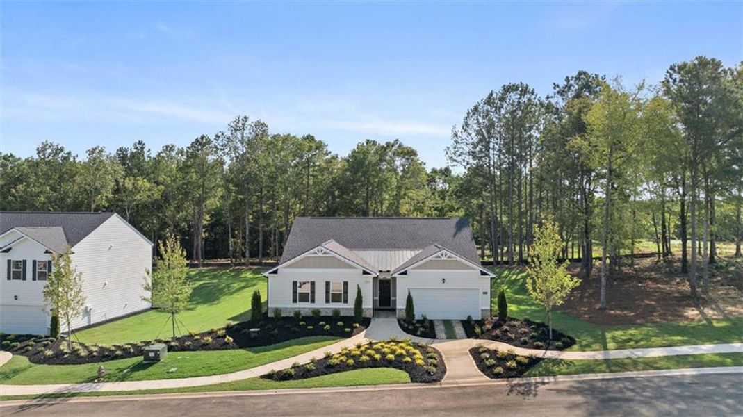 Front exterior of a new home in Bridle Creek, Locust Grove, GA, highlighting curb appeal (Image 27).