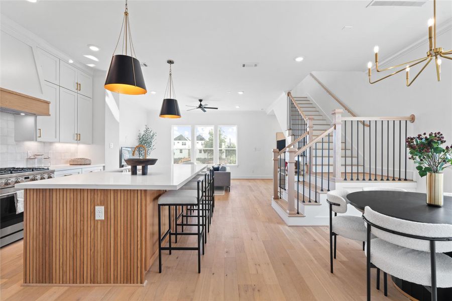 Open concept kitchen and living area with warm, inviting atmosphere.