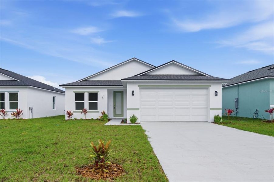 Front exterior of a new home in , Osteen, FL, highlighting curb appeal (Image 27).