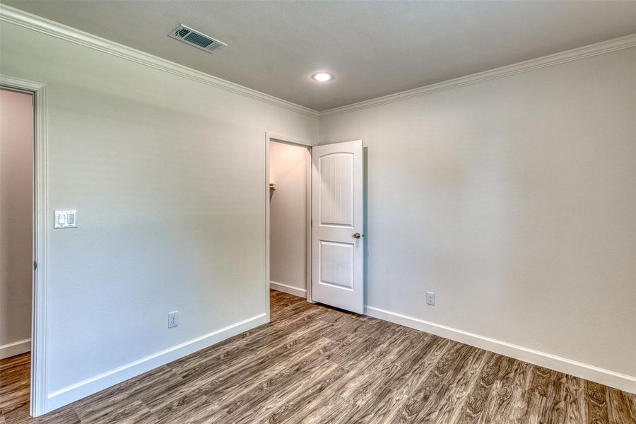 Crisp walls and rich flooring define this adaptable interior space. Crisp walls and rich flooring define this adaptable interior space.