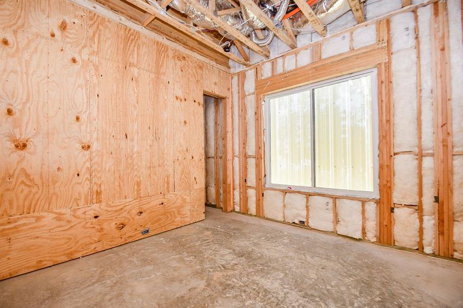 1st floor bedroom with large window.  24x48 tile to be installed.