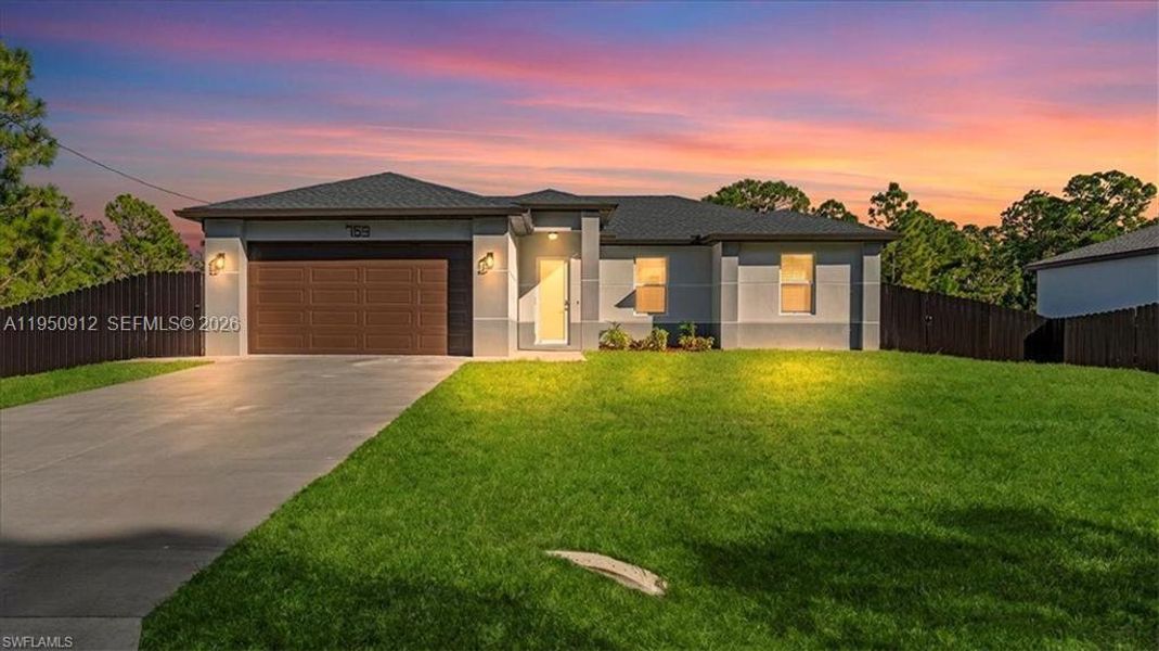 Front exterior of a new home in , Lehigh Acres, FL, highlighting curb appeal (Image 20).
