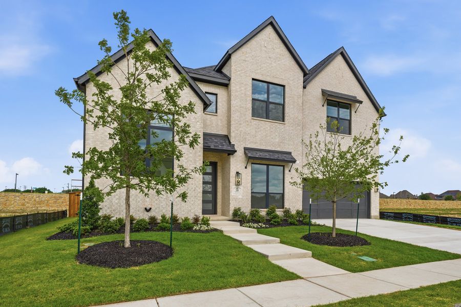 Front exterior of a new home in Custer Ridge Estates, Allen, TX, highlighting curb appeal (Image 1). Front exterior of a new home in Custer Ridge Estates, Allen, TX, highlighting curb appeal (Image 1).