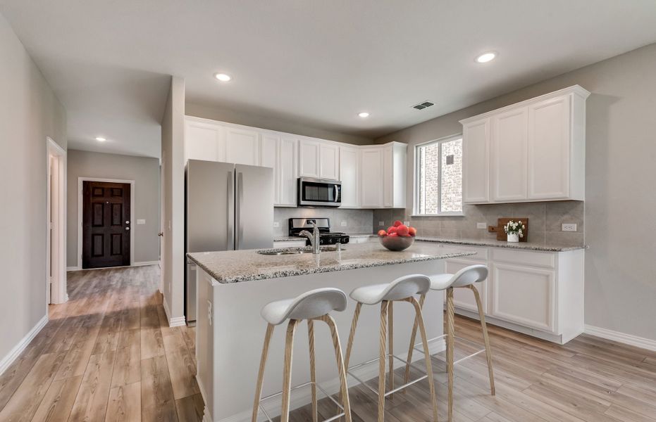 Entry into spacious kitchen with eat-in island