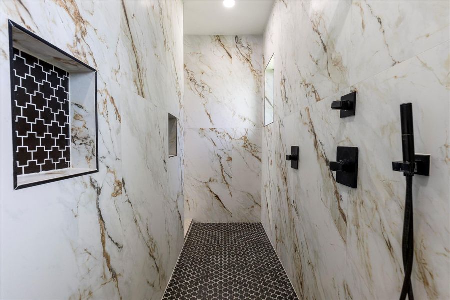 Masterfully crafted walk through shower with plenty of room. Masterfully crafted walk through shower with plenty of room.