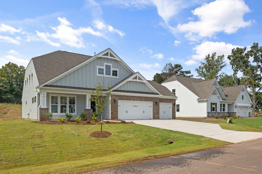 Front exterior of a new home in Grove Park, Clemmons, NC, highlighting curb appeal (Image 19). Front exterior of a new home in Grove Park, Clemmons, NC, highlighting curb appeal (Image 19).