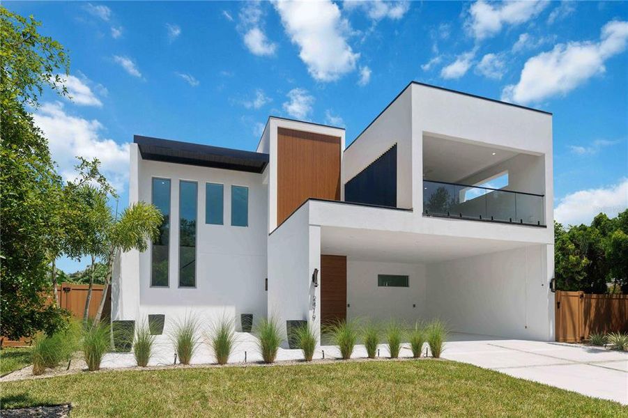 Front exterior of a new home in , Sarasota, FL, highlighting curb appeal (Image 26).