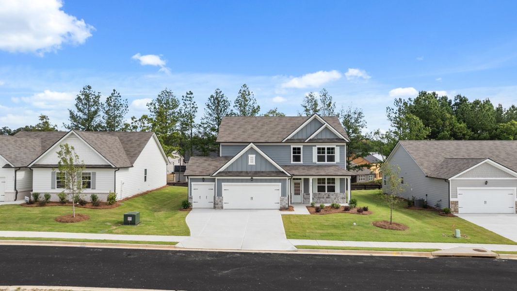 Representative exterior photo of a completed home built from the Elle by D.R. Horton in Fairway 17 at Mirror Lake, Villa Rica, GA (Image 22). Representative exterior photo of a completed home built from the Elle by D.R. Horton in Fairway 17 at Mirror Lake, Villa Rica, GA (Image 22).