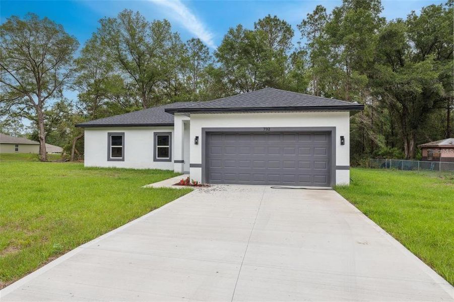 Front exterior of a new home in , Dunnellon, FL, highlighting curb appeal (Image 24).