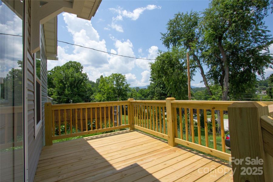 Sunny front deck off Kitchen & Dining area Sunny front deck off Kitchen & Dining area