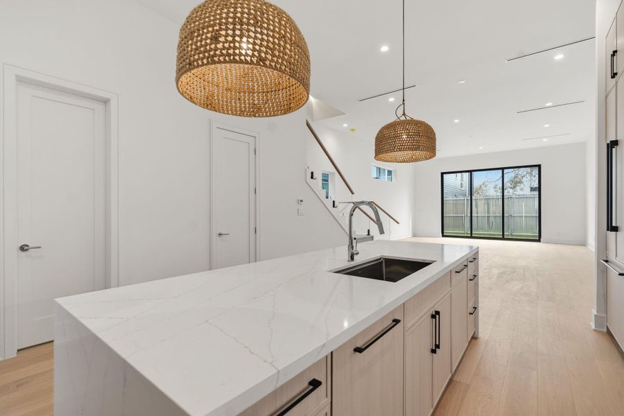 Stunning kitchen with custom cabinetry and Blum soft-close hardware.