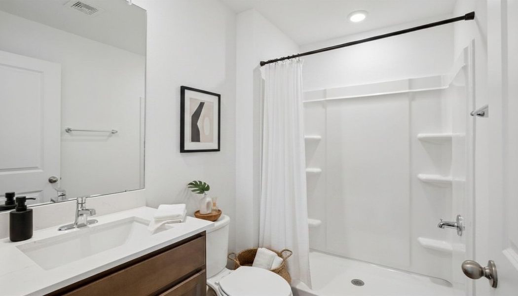 Representative furnished interior of a home built from the Robie Modern by D.R. Horton in Berry Bay, Wimauma (Image 10).