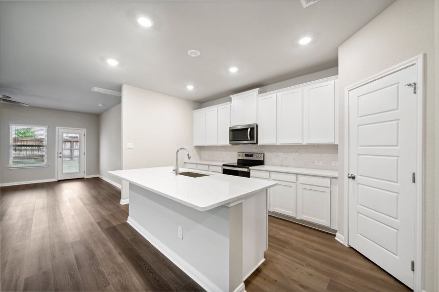 Kitchen in the Reynolds floorplan at a Meritage Homes community.