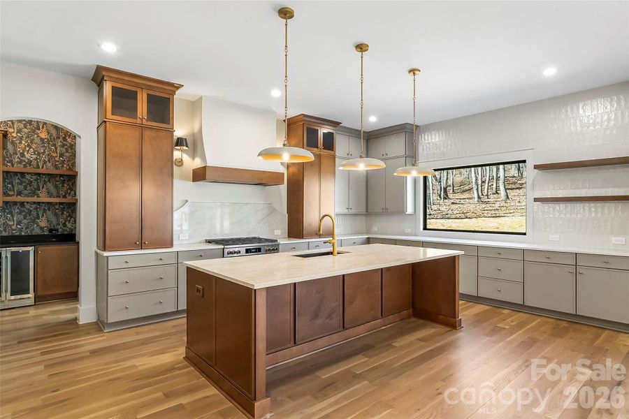 A show-stopping designer kitchen featuring floor-to ceilign cabinetry, striking two tone finishes & lots of storage.