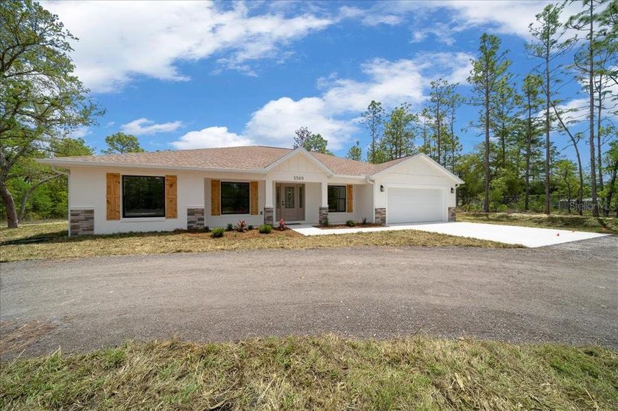 Front exterior of a new home in , Ocala, FL, highlighting curb appeal (Image 29).