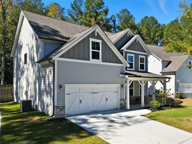 Front exterior of a new home in Riverwood, Dallas, GA, highlighting curb appeal (Image 28).