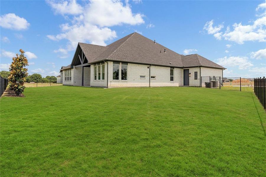 Large Backyard with added door from 3rd car garage to backyard