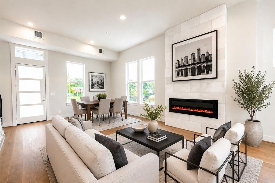 Sleek Electric Flame Color Changing Fireplace Encased in a Marble Surround from Floor to Ceiling (pic was virtually staged)