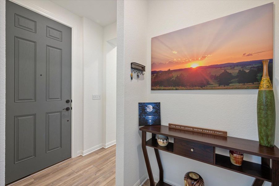 Foyer featuring light wood-style floors and baseboards Foyer featuring light wood-style floors and baseboards
