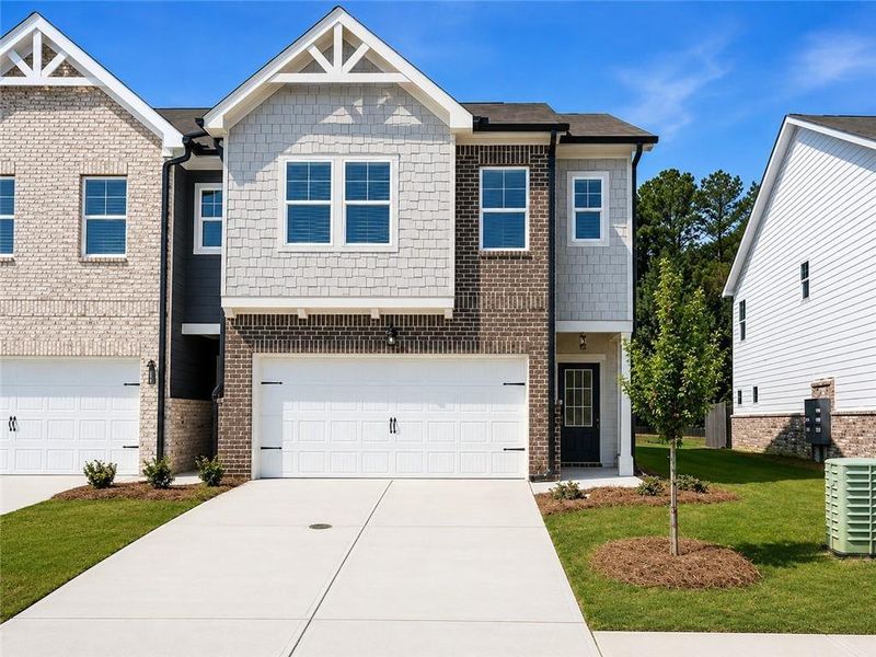 Front exterior of a new home in Union Village, McDonough, GA, highlighting curb appeal (Image 24).