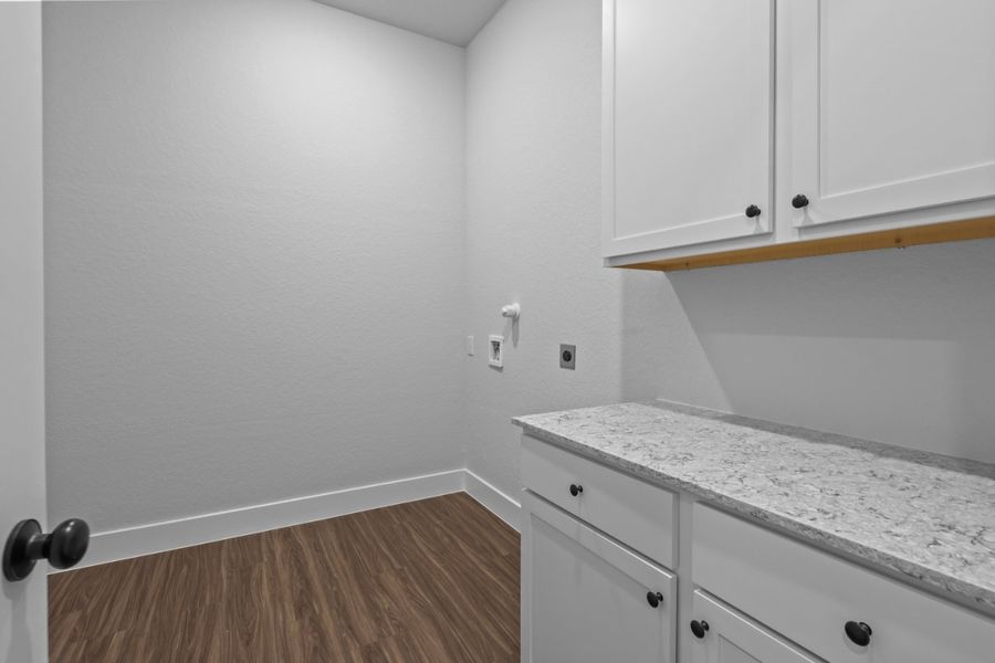 A kitchen with white cabinets. A kitchen with white cabinets.