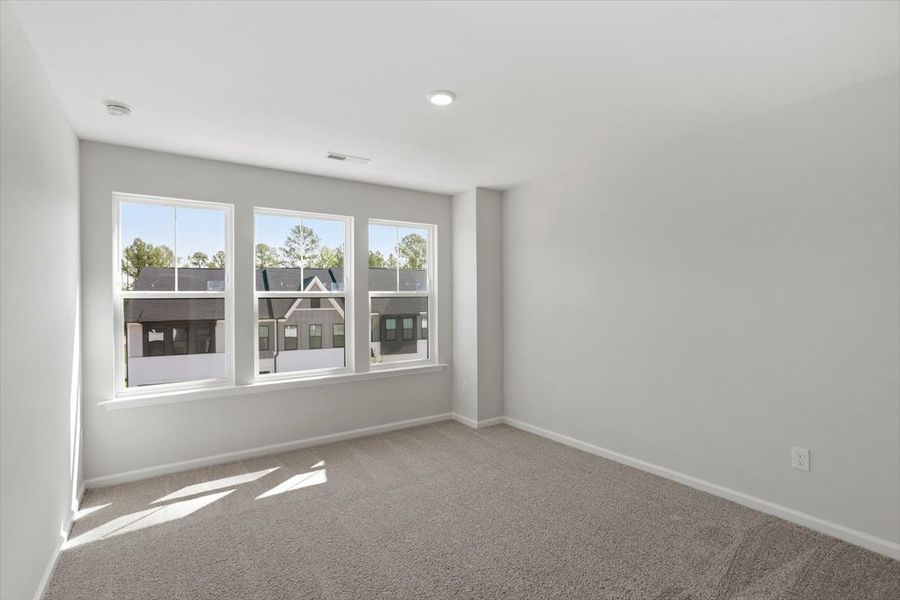 Spacious, unfurnished interior of a new home in Sweetbrier, Durham (Image 27).