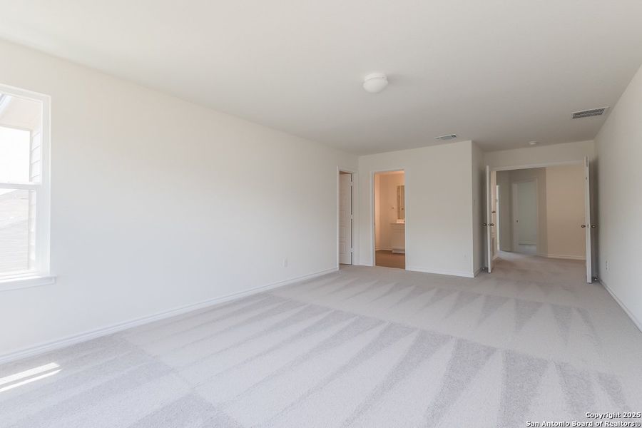 Spacious, unfurnished interior of a new home in Hidden Bluffs at TRP, San Antonio (Image 6).