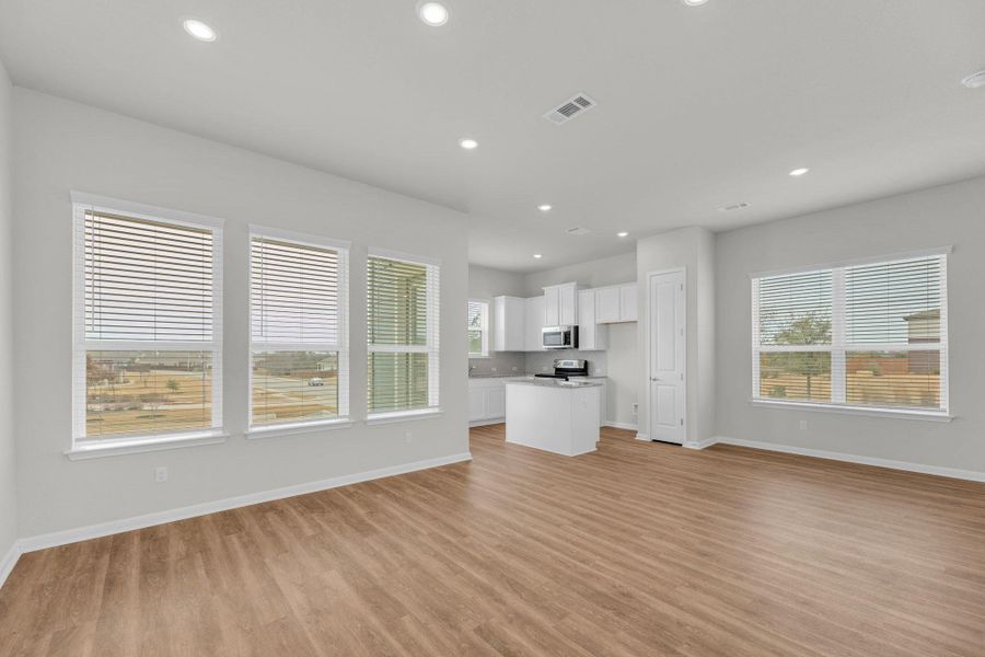 Unfurnished living room featuring light wood-style floors and recessed lighting
