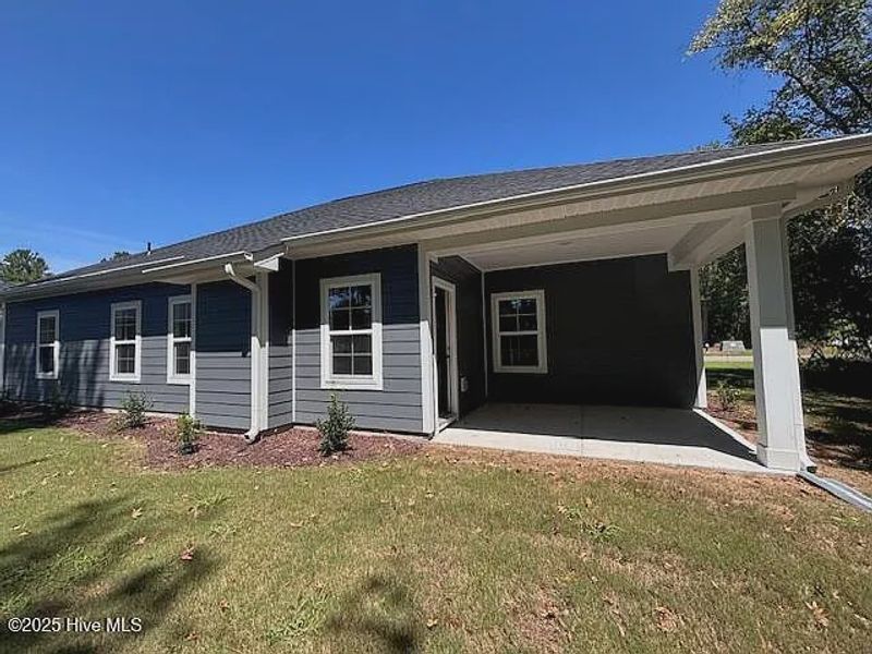 Exterior details and patio area of a home in River Village Square in River Landing, Wallace (Image 2).