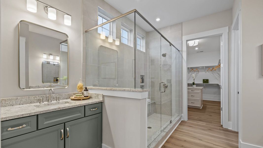 The Inspire Plan with a modern bathroom featuring a glass-enclosed shower with luxury closet Fort Mill, SC