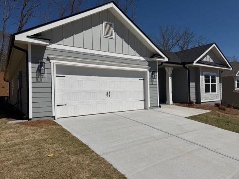 Front exterior of a new home in Thunder Ridge, Dawsonville, GA, highlighting curb appeal (Image 19).