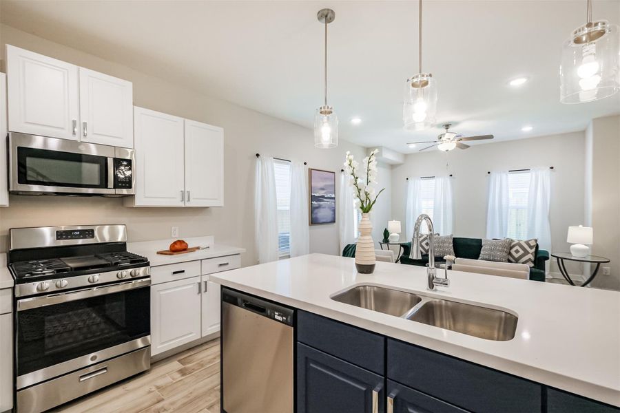 Photos are sample images from a previously built home with the same floor plan. Finishes and fixtures in the current home have been upgraded and may vary.