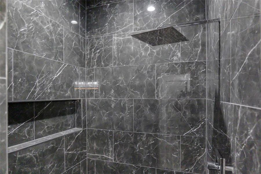 Full bathroom featuring a marble finish shower